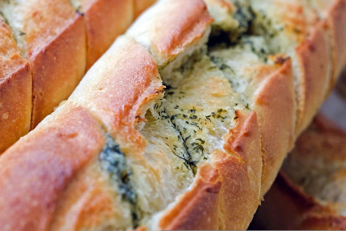 Freshly baked garlic bread loaves with herbs